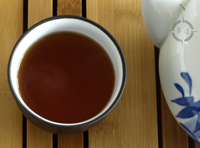 a cup of mandarin peel flavoured shou Pu-erh