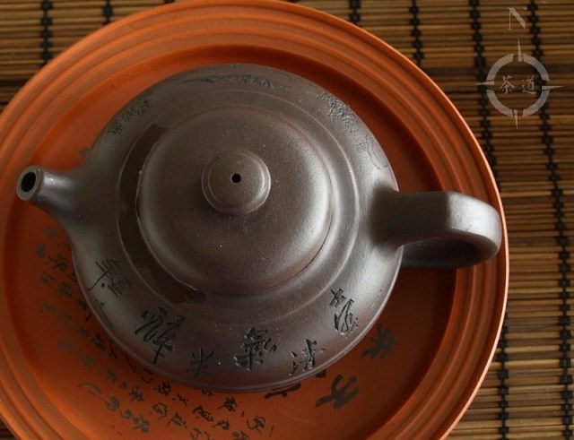 clay teapot on a tea boat