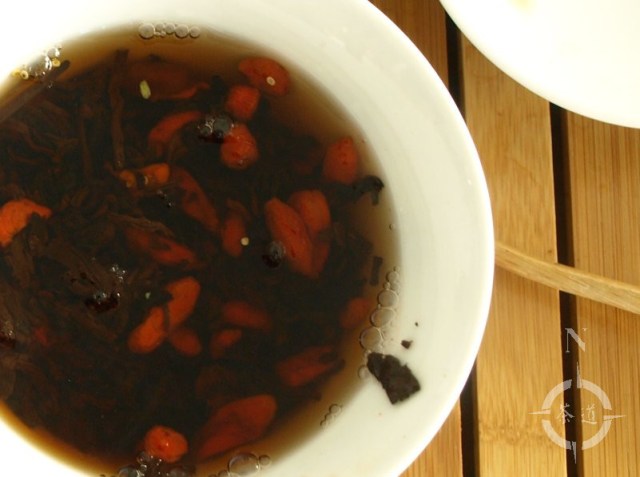 a cup of goji berry shou pu-erh