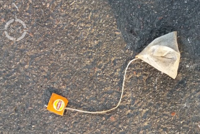 hotel parking lot - used teabag